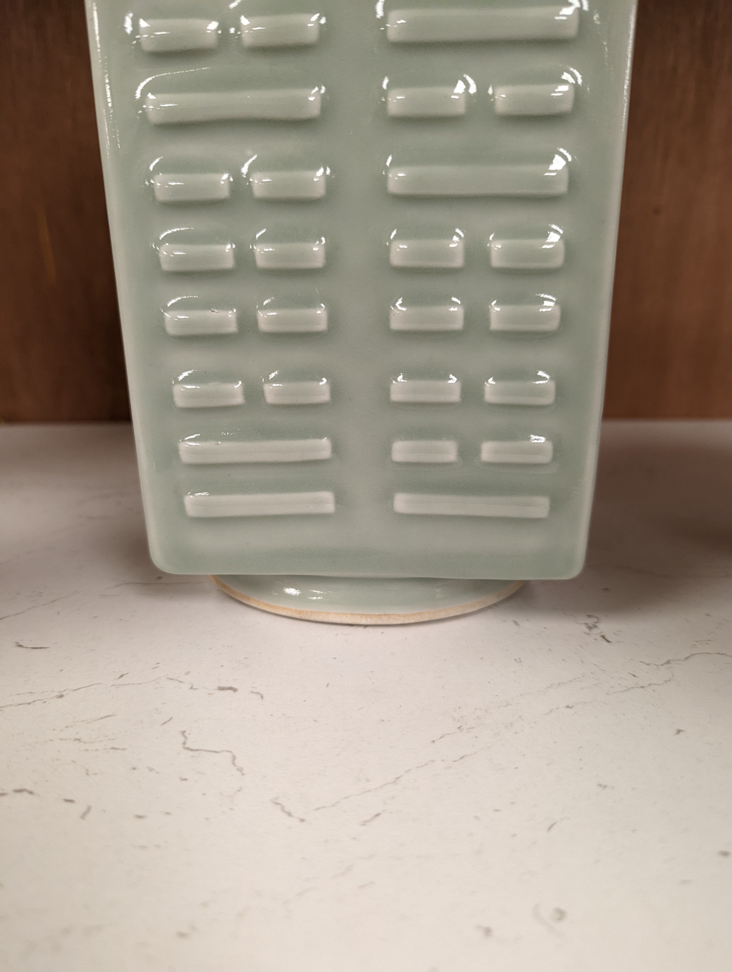 A Chinese celadon glazed eight trigrams cong shaped vase, Guangxu mark and possibly of the period. Provenance - owner bought in auction 20 years ago. 25cm tall